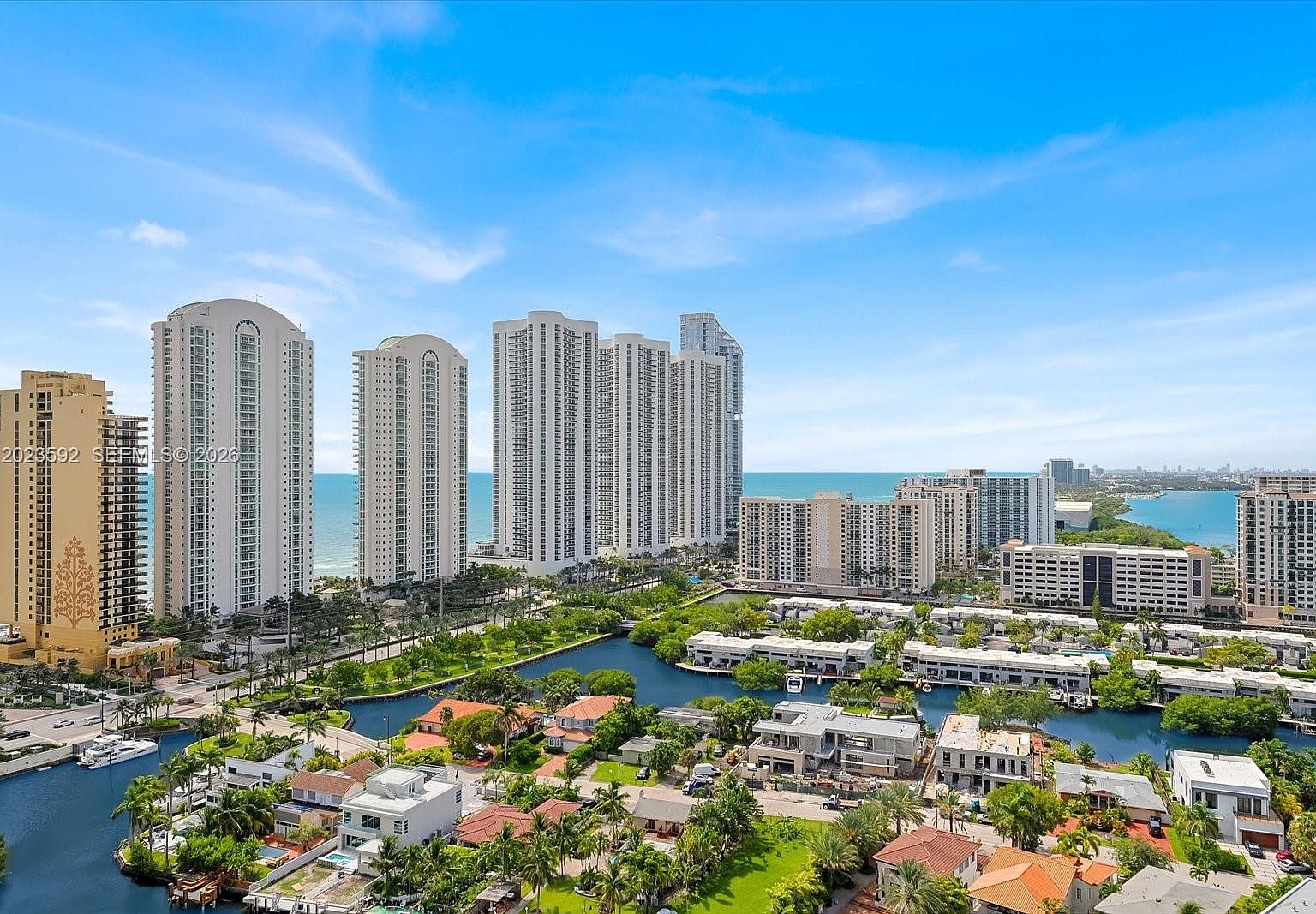 Aerial perspective showing the building's position against the intracoastal waterway and the Atlantic two blocks east