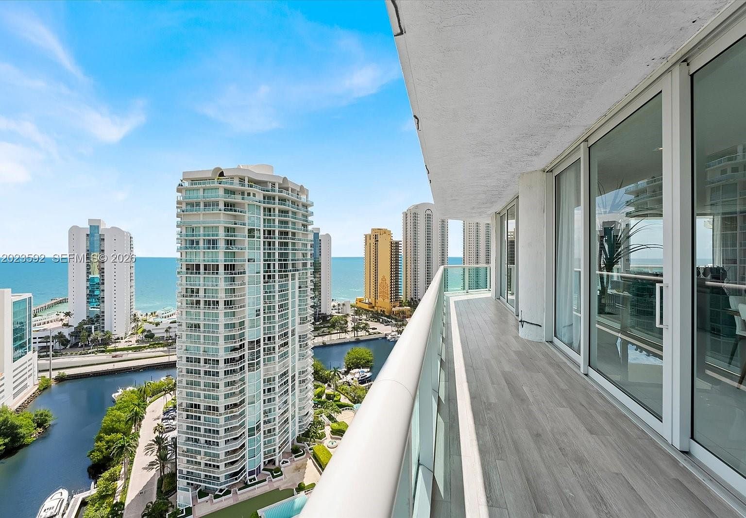 Wrap-around balcony at 16500 Collins, looking south over the Sunny Isles skyline and the Atlantic horizon